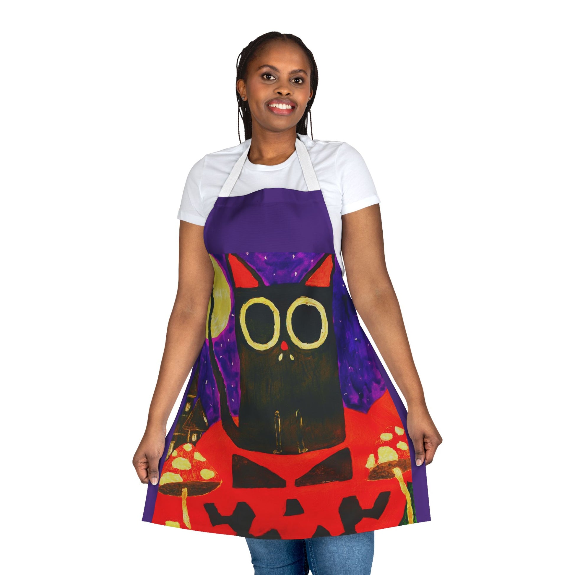 Person wearing a colorful apron with an owl design.